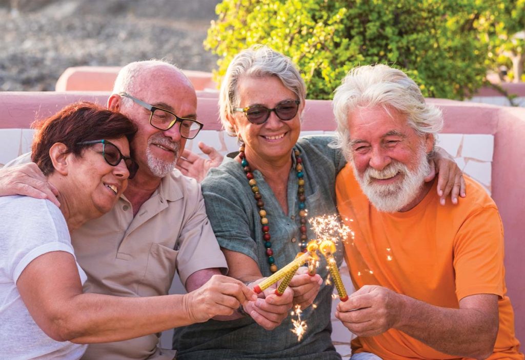 group of senior friends lighting sparklers safe place to save for retirement chicago il